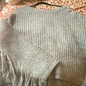 Cute knitted, fringe sweater.